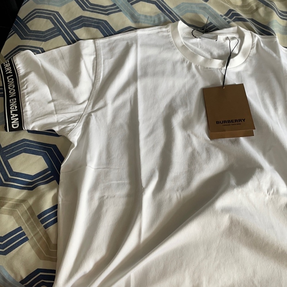 Burberry white tee with. Branding on sleeves
